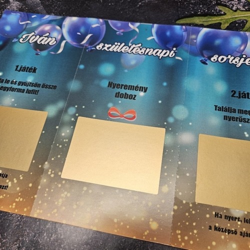 Születésnapi típusú, perforáció mentén több felé téphető prémium egyedi kaparós sorsjegy lekaparható felületekkel és ünnepi grafikával – kreatív közös szülinapi ajándék
