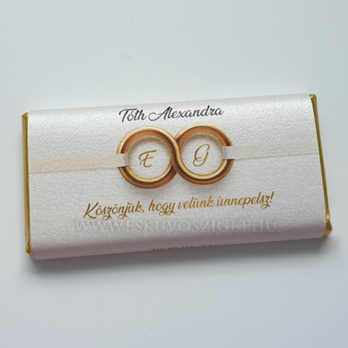 Monogramos arany grafikás gyűrűs köszönetcsokoládé és ültetőkártya egyben vendégnevekkel
